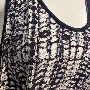 Sleeveless top with knee length skirt